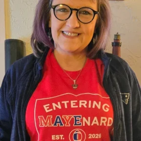 Customer wearing her red Entering Mayenard shirt
