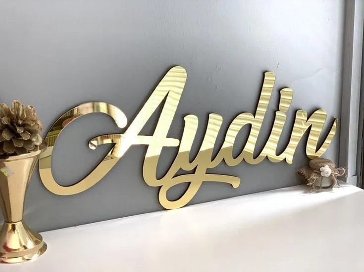 Gold acrylic name letters reading Aydin